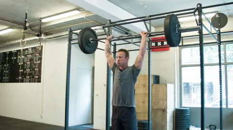 Trainer Executing Push Press Weightlifting Movement at a CrossFit Box Stock-Footage 40033742