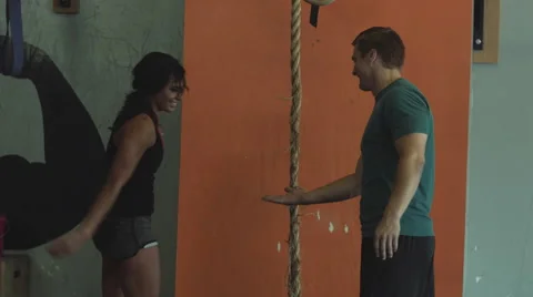 Trainer gives congratulates client Stock Footage 54991265