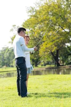 Trainer golf tutor practice for new golf player. Stock Photos