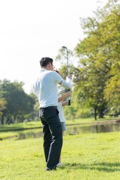 Trainer golf tutor practice for new golf player. Stock Photos