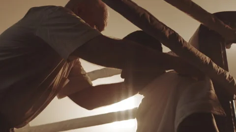 Trainer helping the boxer in a match Stock Footage 283293883