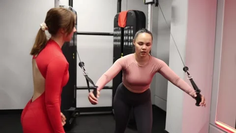 Trainer helps improve exercise form Stock Footage 337114829
