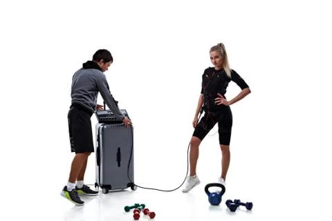 Trainer helps setting ems Stock Photos