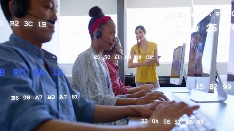 Trainer holding tablet training call center agents typing on keys while code Stock Footage 333817425
