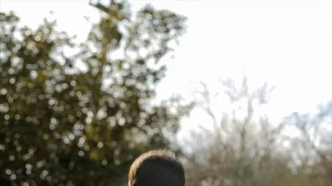 Trainer instructing class doing squats. 스톡 동영상 88407331