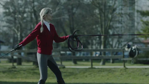 Trainer Lashing with Whip for Fast Run Stallion Stock Footage 148327643