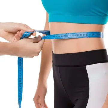Trainer measuring figure parameters cropped shot Stock Photos