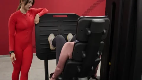Trainer motivates tired gym client Stock Footage 337114660