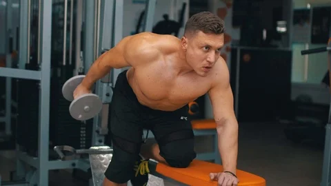 Trainer pumps the muscles of the back Stock Footage 87269479