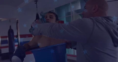 Trainer reaching, pouring water, boxer drinking between rounds in boxing gym, Stock Footage 332296454