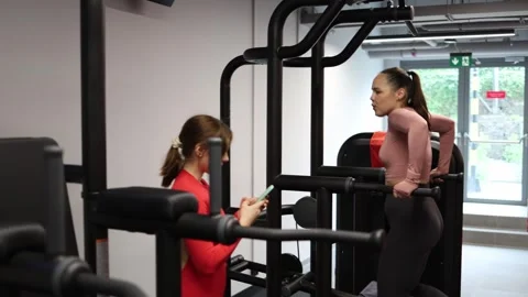 Trainer records client fitness progress Stock Footage 337114641