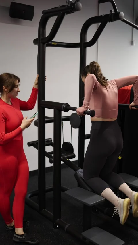 Trainer records client workout progress Stock Footage 337956818