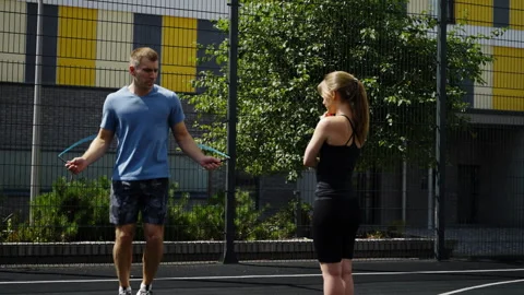 The trainer shows how to train on the rope. Sports hobbies. Outdoor training Stock Footage 254170755