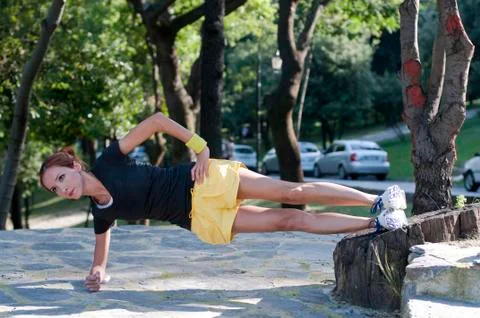 Trainer stretching in forest Stock-Fotos