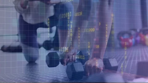 Trainer tapping tablet cueing women doing plank rows with hex weights for Stock Footage 334242430