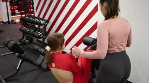 Trainer teaches exercise technique Stock Footage 337114896