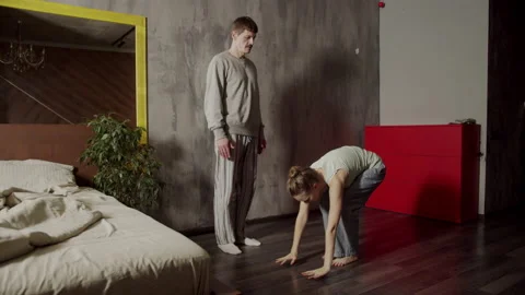 The trainer teaches a young female client how to perform the most popular yoga Video stock 145081821