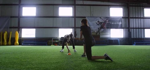 Trainer watching the athlete running back and forth in the fitness studio Stock Footage 78205246