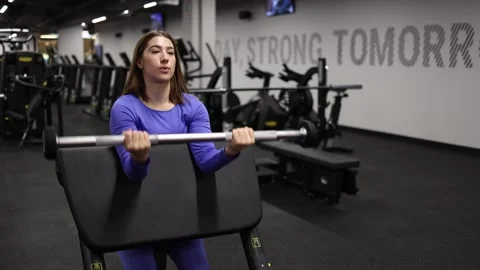 Trainer working on arm strength Stock Footage 328253558