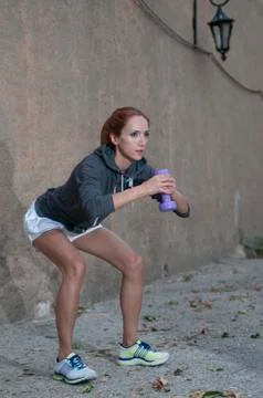 Trainer workout with dumbbell Stockfoto's