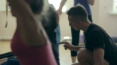 The trainer of yoga helps students Stock Footage 64809241