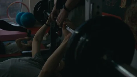 Trainers help on bench press Stock Footage 88507074