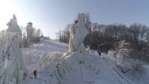 Training and ice climbing competition on ice pillars. Russia. Winter aerial view 스톡 동영상 86514402