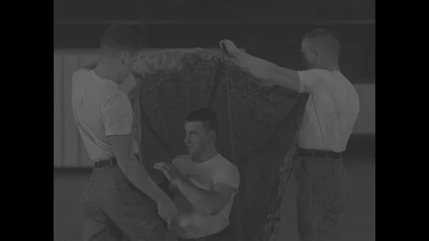 Training and packing of cargo and G-11 parachute in airdrop hangar - 1967 스톡 동영상 118316252