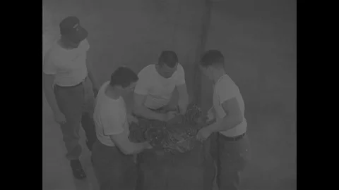Training and packing of cargo and G-11 parachute in airdrop hangar - 1967 스톡 동영상 118316262