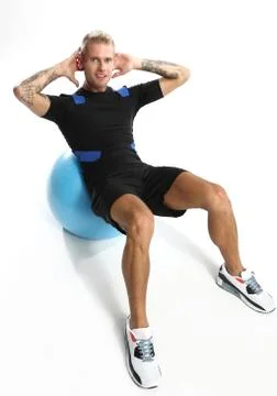 Training on the ball, crunches, slopes  Stock Photos