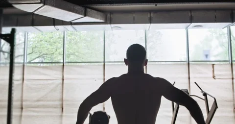 Training with barbell, intense strength exercise in closed gym. Men doing Video stock 130014658