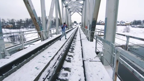 Training boxer on the bridge in winter Stock Footage 83620179