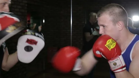 Training a boxer at the gym Stock Footage 67456206
