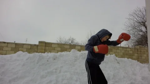 Training in boxing. Special boxing exercises in the winter. Stock Footage 87739470