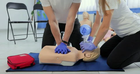 Training compression on a dummy. CPR exercise on a mannequin in the medical Stock Footage 163980577