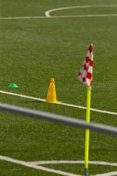 Training cones and corner flag on artificial turf soccer field Stock Photos