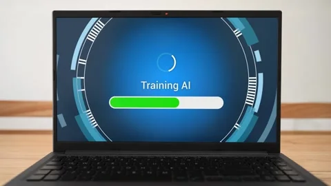 Training custom AI on laptop. Concept of developing new artificial intelligence Stock Footage 310318192