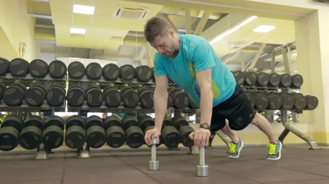 Training with dumbbells in the gym Stock Footage 47859573
