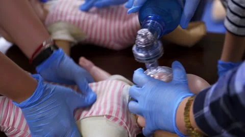 Training dummy used by paramedic trainees. Pediatric courses for medics. Stock Footage 148828812