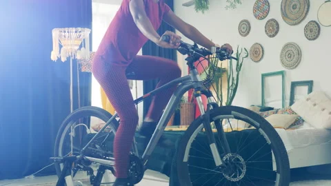 Training exercise is being done by an african lady on the exercycle. Sport at Stock Footage 267528654