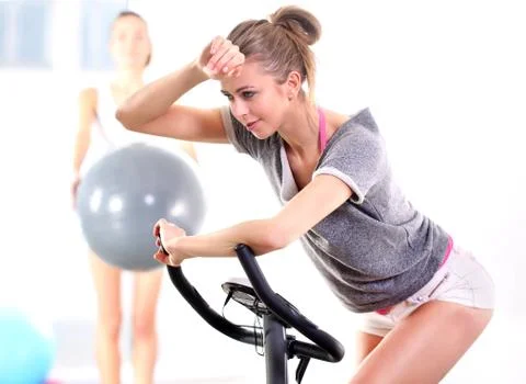 Training on exercise bike  Stock Photos
