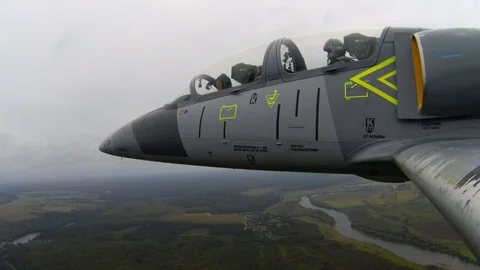Training fighter plane fly in sky. The chassis open and lowers. Close up view. Stock-Footage 118677015