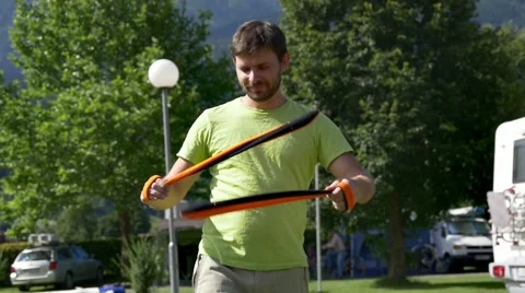 Training for fire show - man spinning snakes Stock Footage 67384393