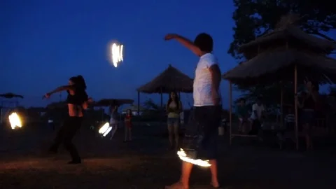 Training fireshow on the night beach Stock Footage 83264867