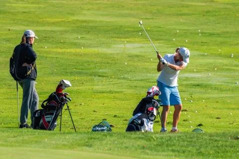 Training of golfers. Stock Photos