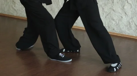 Training in the hall. Two men practicing the elements of tai chi Video stock 64591525