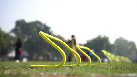 Training Hurdles for Field Training and Speed Coordination ! Hurdles for Kid Stock Footage 317842161