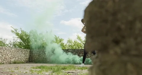 Training with kettlebells, intense strength exercise outdoor with smoke Stock Footage 132854567