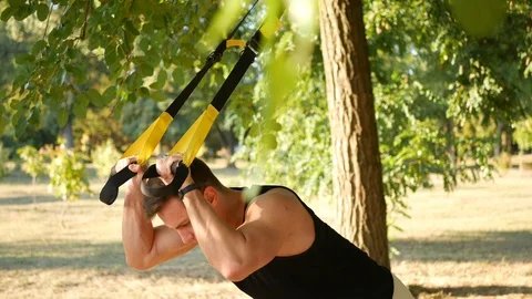 The training outdoors, the trx Stock Footage 114180512