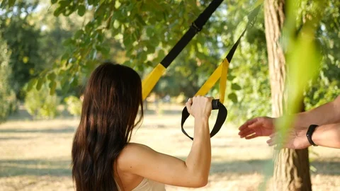 The training outdoors, the trx Stock Footage 114180557